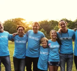 Volunteers holding eachother