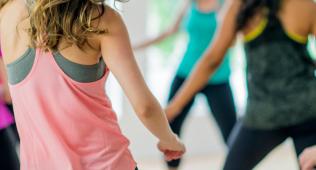 Backs of women in zumba class